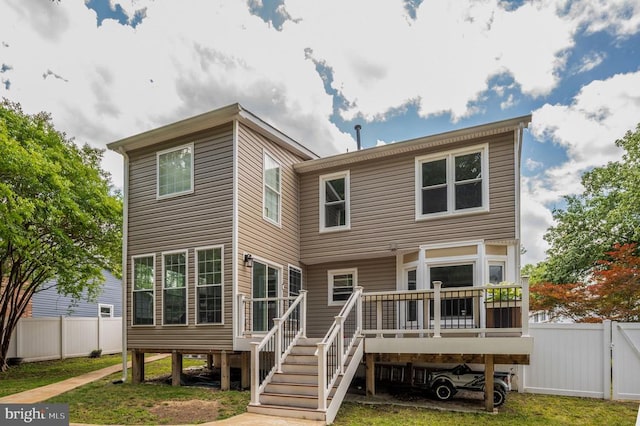 11603 Enchanted Woods Way, Fredericksburg, VA 22407 - rear view of house with a wooden deck, stairs, and a gate