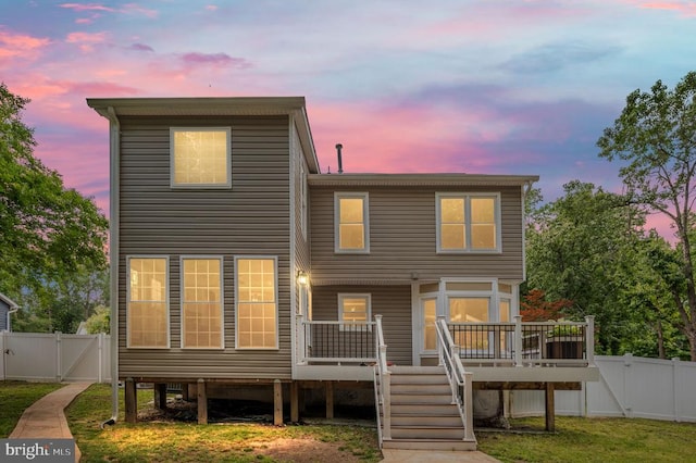 11603 Enchanted Woods Way, Fredericksburg, VA 22407 - back of house at dusk featuring a gate, a deck, and a fenced backyard