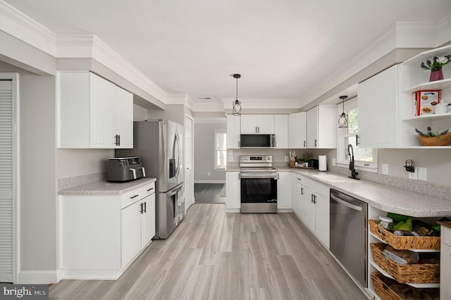 11603 Enchanted Woods Way, Fredericksburg, VA 22407 - kitchen featuring appliances with stainless steel finishes, a sink, open shelves, light wood finished floors, and ornamental molding