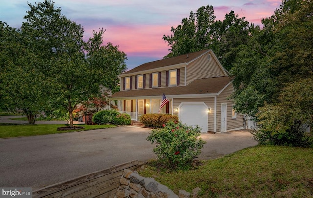 11603 Enchanted Woods Way, Fredericksburg, VA 22407 - view of front of home with driveway, a garage, a porch, and a yard