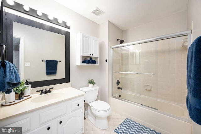 11603 Enchanted Woods Way, Fredericksburg, VA 22407 - bathroom with toilet, vanity, tile patterned floors, and combined bath / shower with glass door