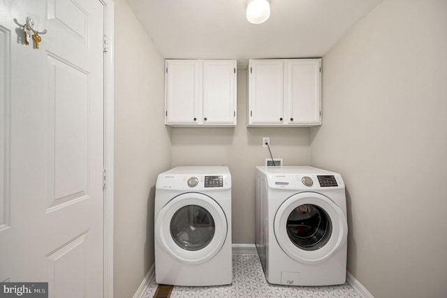 11603 Enchanted Woods Way, Fredericksburg, VA 22407 - washroom featuring cabinet space, washer and clothes dryer, baseboards, and light tile patterned floors