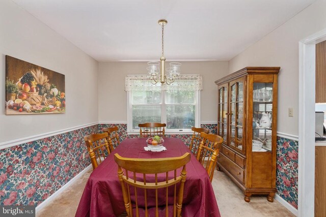 13403 Motts Run Rd, Fredericksburg, VA 22407 - dining area with a chandelier, carpet, wallpapered walls, and a wainscoted wall