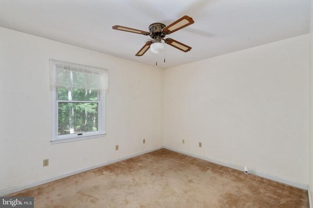 13403 Motts Run Rd, Fredericksburg, VA 22407 - empty room featuring light colored carpet, baseboards, and a ceiling fan