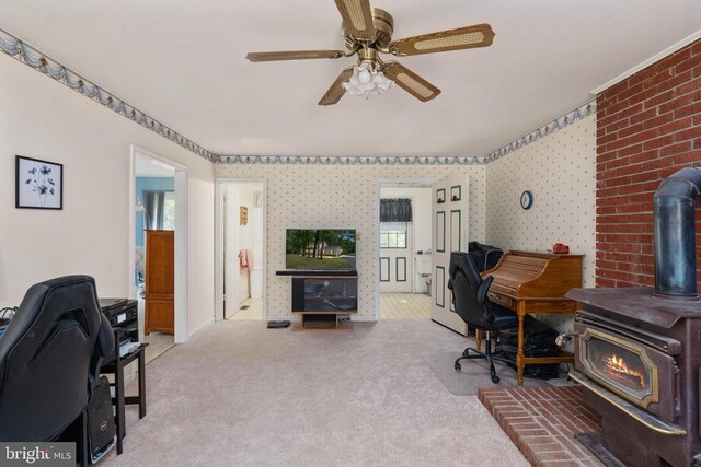 13403 Motts Run Rd, Fredericksburg, VA 22407 - office area featuring a wood stove, carpet flooring, and ceiling fan