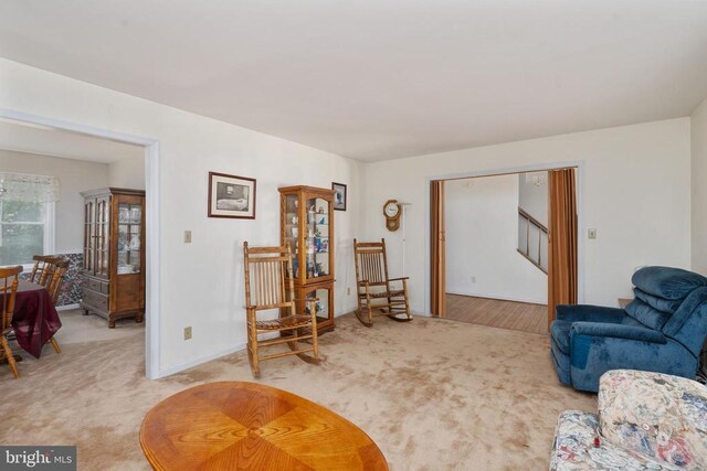 13403 Motts Run Rd, Fredericksburg, VA 22407 - living area with light carpet, stairs, and baseboards
