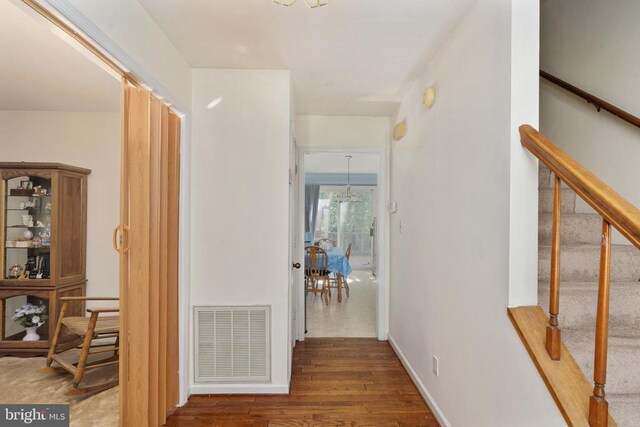 13403 Motts Run Rd, Fredericksburg, VA 22407 - corridor with wood finished floors, stairway, and baseboards