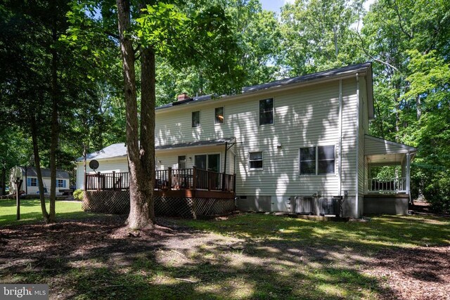 13403 Motts Run Rd, Fredericksburg, VA 22407 - rear view of house with a deck, a lawn, and a chimney