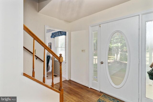 13403 Motts Run Rd, Fredericksburg, VA 22407 - entrance foyer with wood finished floors, stairs, plenty of natural light, and baseboards