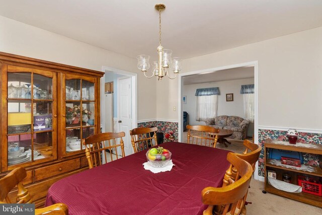 13403 Motts Run Rd, Fredericksburg, VA 22407 - carpeted dining area with a chandelier and a wainscoted wall