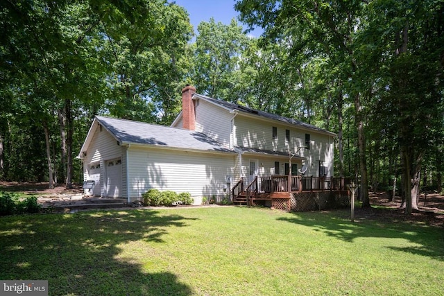 13403 Motts Run Rd, Fredericksburg, VA 22407 - back of property with a chimney, an attached garage, a lawn, and a wooden deck