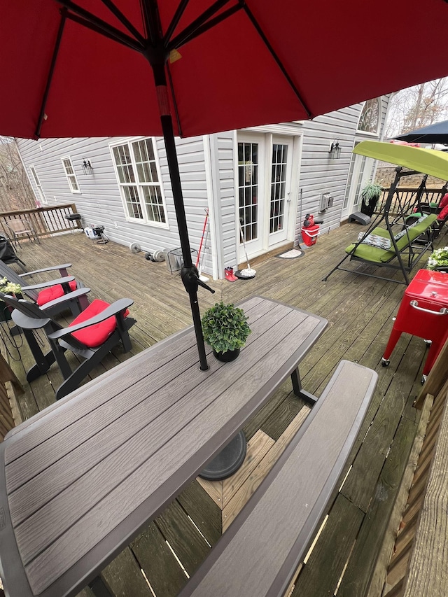 wooden deck featuring outdoor dining space