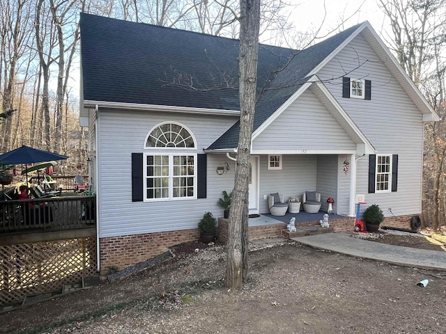 view of front facade featuring a porch and a shingled roof