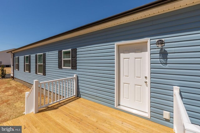 entrance to property with a deck