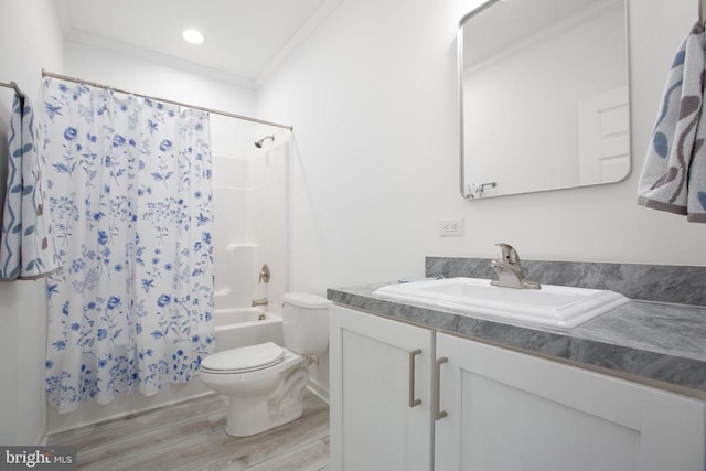 full bath with ornamental molding, toilet, wood finished floors, shower / bath combo with shower curtain, and vanity