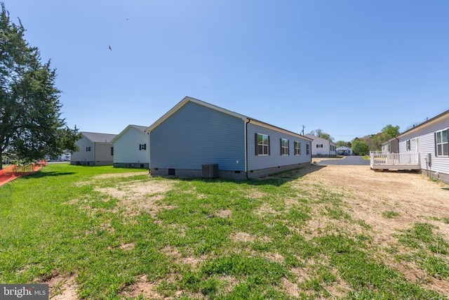 back of property with cooling unit and crawl space