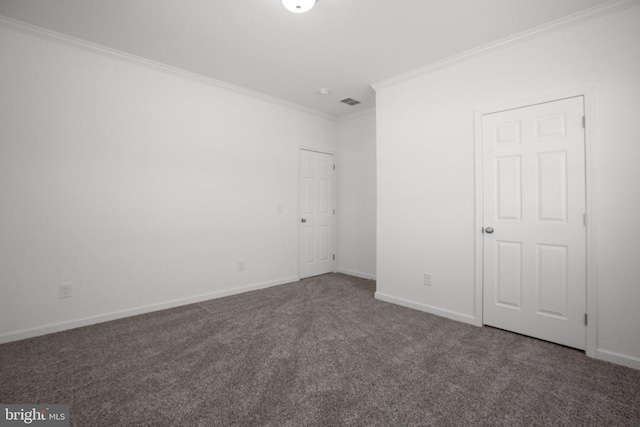 unfurnished bedroom featuring ornamental molding, carpet floors, and baseboards