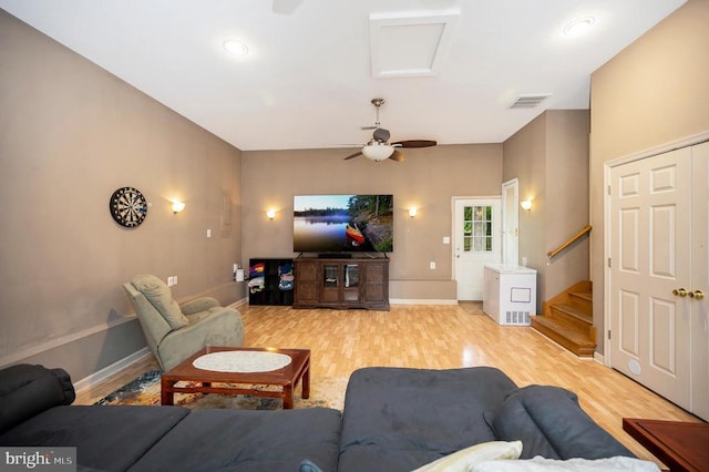 10118 New Scotland Dr, Fredericksburg, VA 22408 - living room featuring light wood-style floors, a ceiling fan, stairway, and baseboards