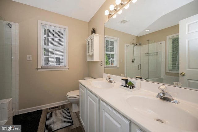 10118 New Scotland Dr, Fredericksburg, VA 22408 - full bath with tiled shower, toilet, double vanity, and baseboards