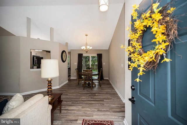 10118 New Scotland Dr, Fredericksburg, VA 22408 - foyer featuring a chandelier, high vaulted ceiling, wood finished floors, and baseboards