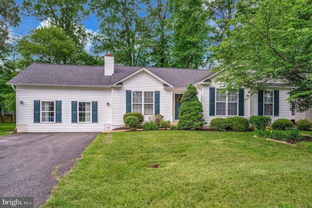 10118 New Scotland Dr, Fredericksburg, VA 22408 - view of front of house featuring a chimney, a shingled roof, a front yard, and driveway