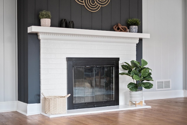 928 Baylor St, Staunton, VA 22401 - detailed view of a fireplace, wood finished floors, and baseboards