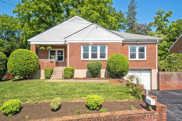 928 Baylor St, Staunton, VA 22401 - bungalow with driveway, a garage, brick siding, and a front lawn