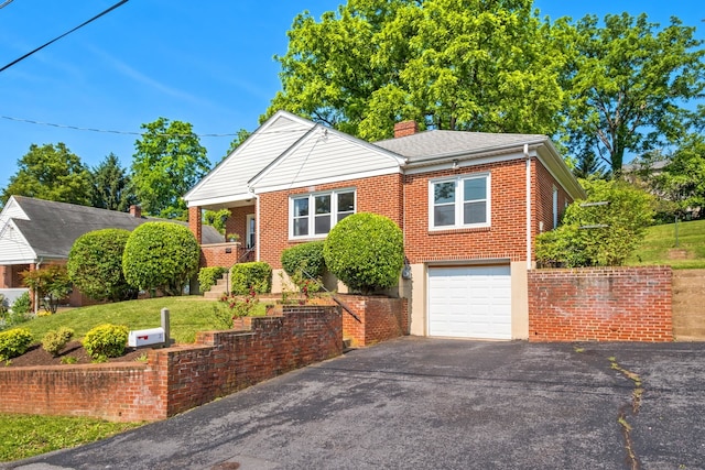 928 Baylor St, Staunton, VA 22401 - bungalow-style home with a chimney, brick siding, a garage, and driveway