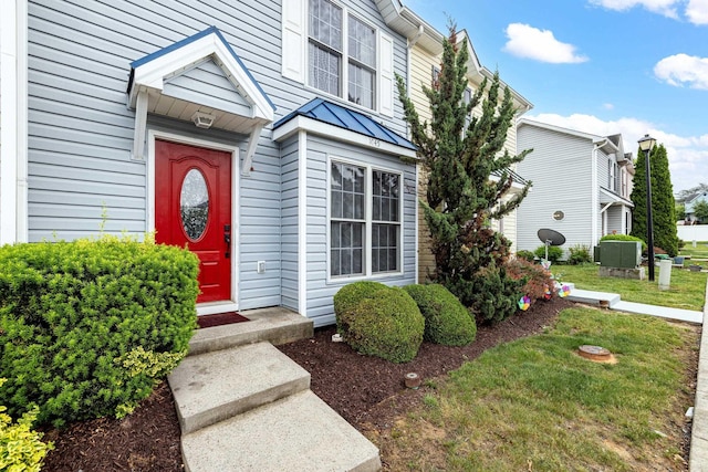 1045 Alexander Hamilton Ln, Harrisonburg, VA 22802 - property entrance with a standing seam roof, metal roof, and a lawn