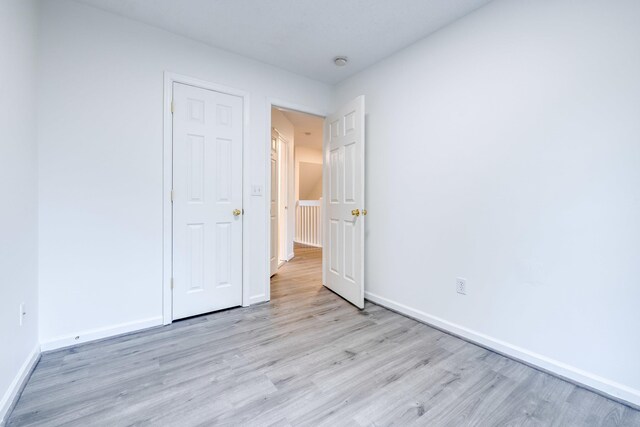 1045 Alexander Hamilton Ln, Harrisonburg, VA 22802 - unfurnished bedroom with wood finished floors and baseboards