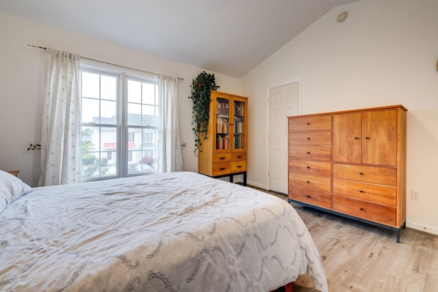 1045 Alexander Hamilton Ln, Harrisonburg, VA 22802 - bedroom featuring lofted ceiling, light wood-type flooring, and baseboards
