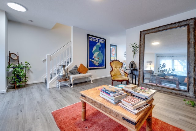 1045 Alexander Hamilton Ln, Harrisonburg, VA 22802 - living room featuring wood finished floors, stairs, and baseboards