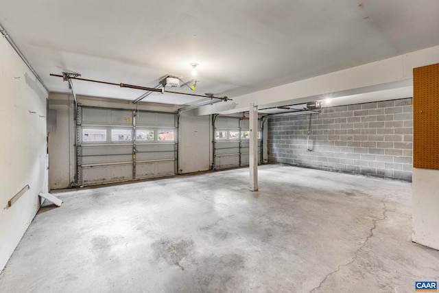 7 Englewood Dr, Palmyra, VA 22963 - garage featuring concrete block wall and a garage door opener