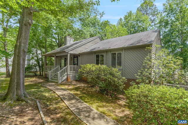 7 Englewood Dr, Palmyra, VA 22963 - view of front of property featuring covered porch, a shingled roof, and a chimney