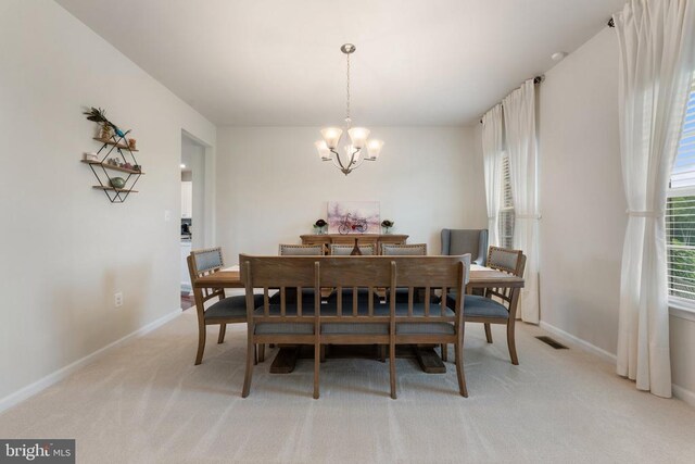 12804 Monterey Ct, Fredericksburg, VA 22407 - dining area with a chandelier, healthy amount of natural light, light colored carpet, and baseboards