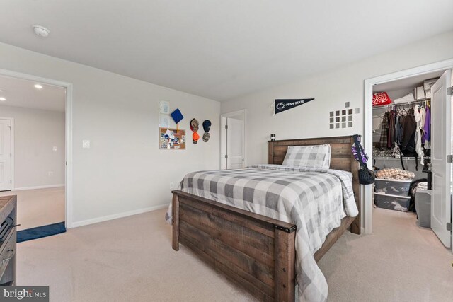 12804 Monterey Ct, Fredericksburg, VA 22407 - bedroom with light colored carpet, a walk in closet, baseboards, a closet, and recessed lighting