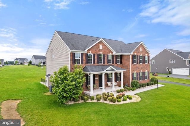 12804 Monterey Ct, Fredericksburg, VA 22407 - view of front facade featuring brick siding and a front lawn