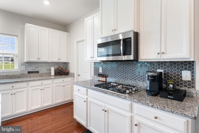 12804 Monterey Ct, Fredericksburg, VA 22407 - kitchen featuring stainless steel appliances, white cabinets, backsplash, and light stone countertops