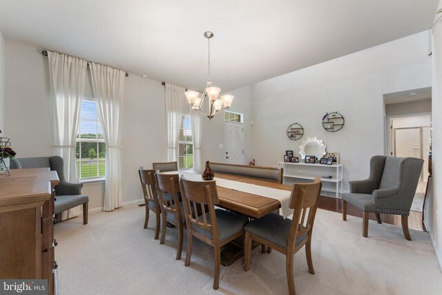 12804 Monterey Ct, Fredericksburg, VA 22407 - dining space with a chandelier, light carpet, and baseboards