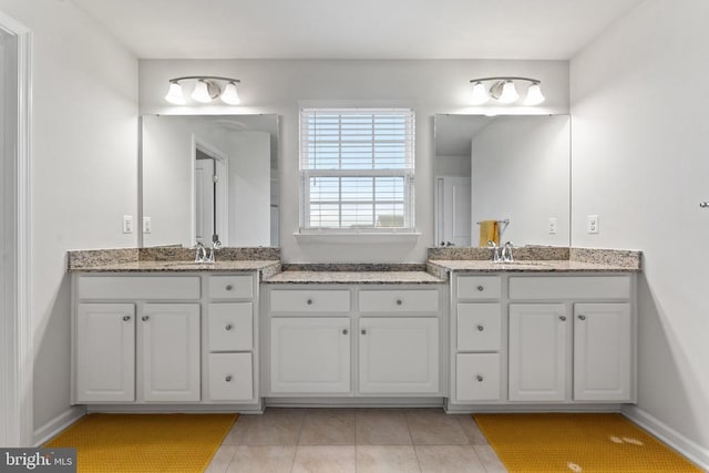 12804 Monterey Ct, Fredericksburg, VA 22407 - bathroom with two vanities, tile patterned floors, and baseboards