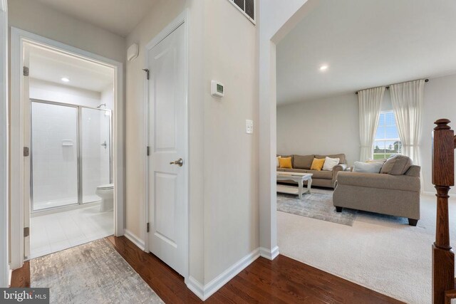 12804 Monterey Ct, Fredericksburg, VA 22407 - hall with dark wood-style flooring, baseboards, arched walkways, and recessed lighting