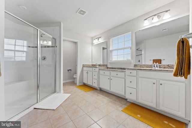 12804 Monterey Ct, Fredericksburg, VA 22407 - bathroom featuring double vanity, a stall shower, toilet, and tile patterned floors