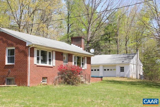 6928 Blackwells Hollow Rd, Crozet, VA 22932 - view of front of house with a chimney, a front yard, brick siding, and a detached garage