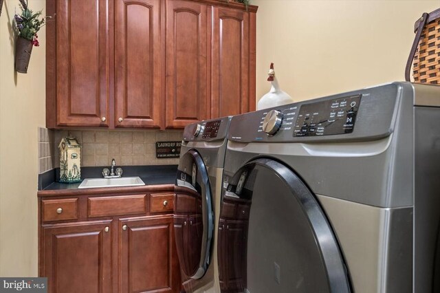 11110 Park Ridge Rd, Fredericksburg, VA 22408 - washroom with washing machine and clothes dryer, a sink, and cabinet space