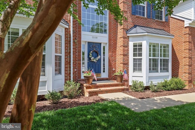 11110 Park Ridge Rd, Fredericksburg, VA 22408 - view of exterior entry with metal roof, a standing seam roof, and brick siding