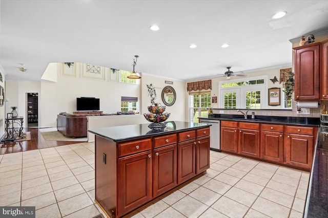 11110 Park Ridge Rd, Fredericksburg, VA 22408 - kitchen with a sink, stainless steel dishwasher, dark countertops, and light tile patterned floors