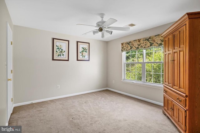 11110 Park Ridge Rd, Fredericksburg, VA 22408 - unfurnished bedroom with baseboards, light carpet, visible vents, and a ceiling fan