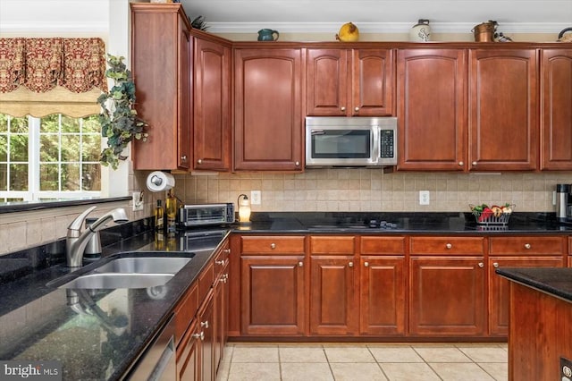 11110 Park Ridge Rd, Fredericksburg, VA 22408 - kitchen with a sink, dark stone countertops, crown molding, backsplash, and appliances with stainless steel finishes