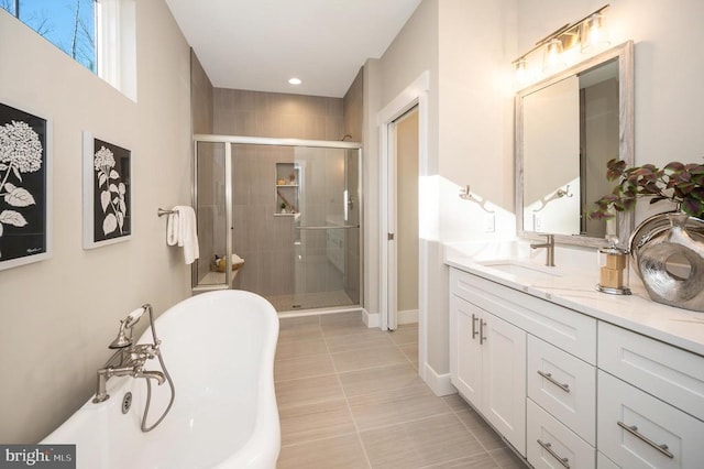 92 Mill Run, Bumpass, VA 23024 - full bathroom with a stall shower, tile patterned floors, a freestanding bath, baseboards, and vanity