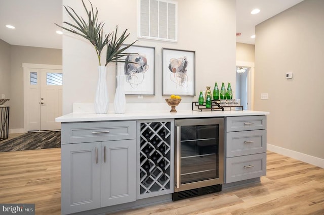 92 Mill Run, Bumpass, VA 23024 - bar featuring visible vents, recessed lighting, light wood finished floors, beverage cooler, and baseboards